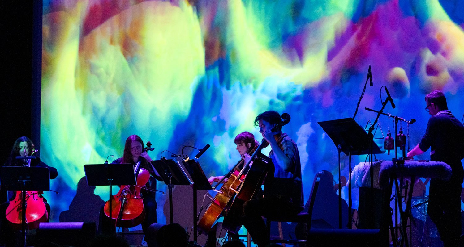 cello esemble with colorful background